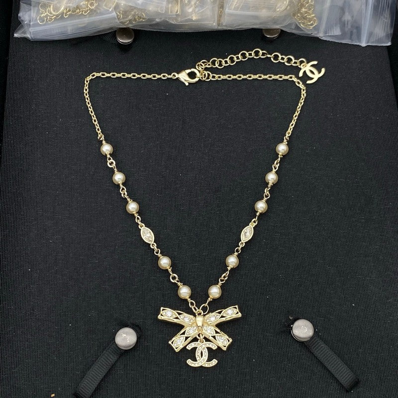 18K  Chanel Bow Tie Diamond Gold Necklace